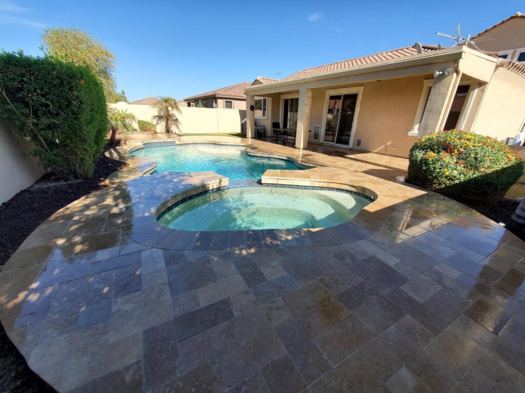 Clean backyard pool and spa after professional pool cleaning by Aqua Squad in Mesa