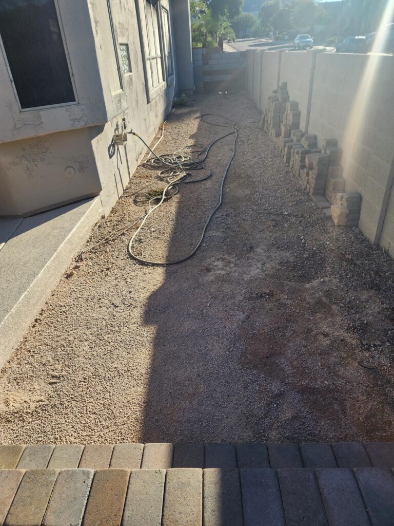 Backyard preparation and grading before paver installation