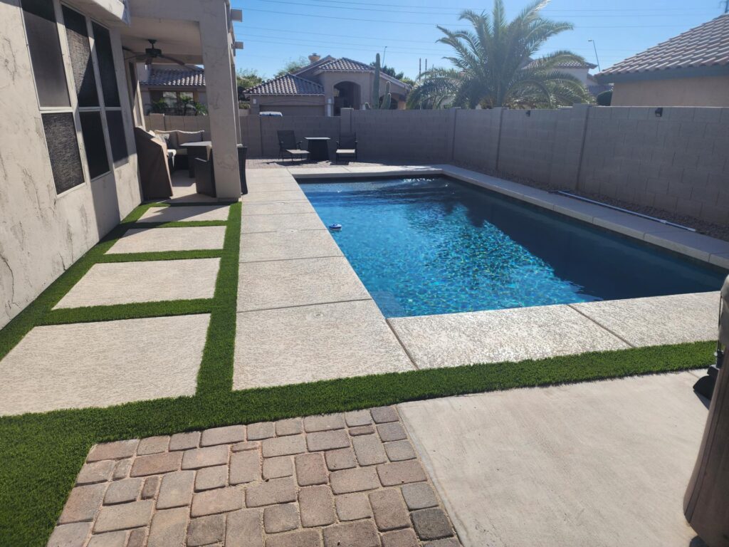 Backyard pool renovation featuring new decking and water-clear finish