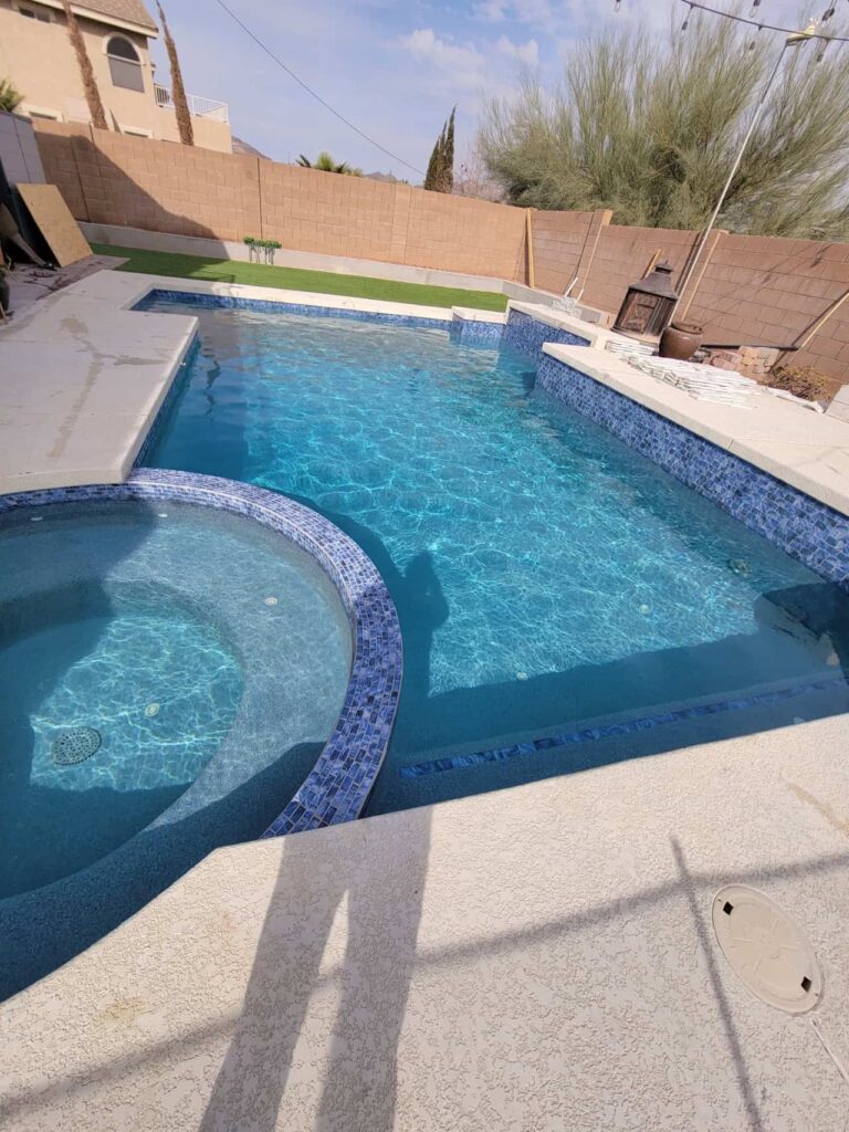 backyard swimming pool with clear water