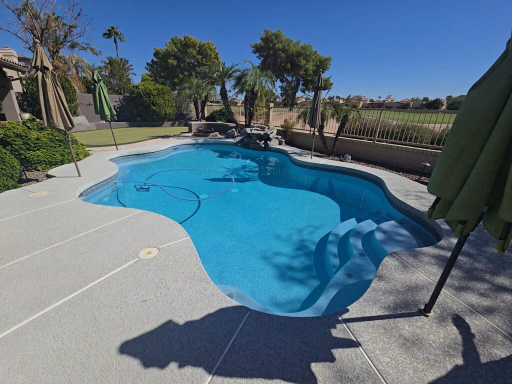 resort-style residential pool with sparkling blue water
