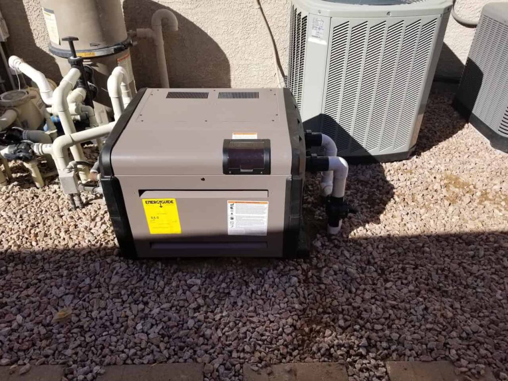 New pool heater installation connected to pool filtration system