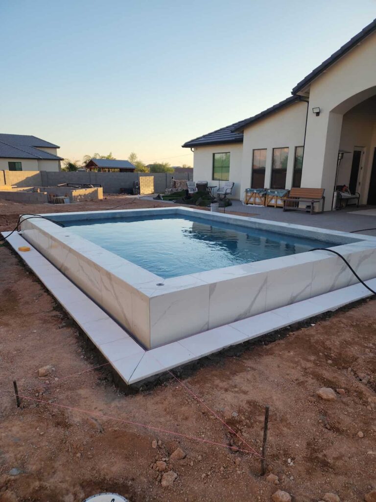 new backyard pool build near completion