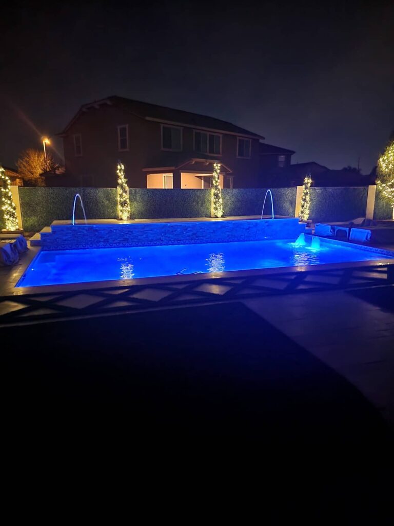 new pool construction with lighting and water features