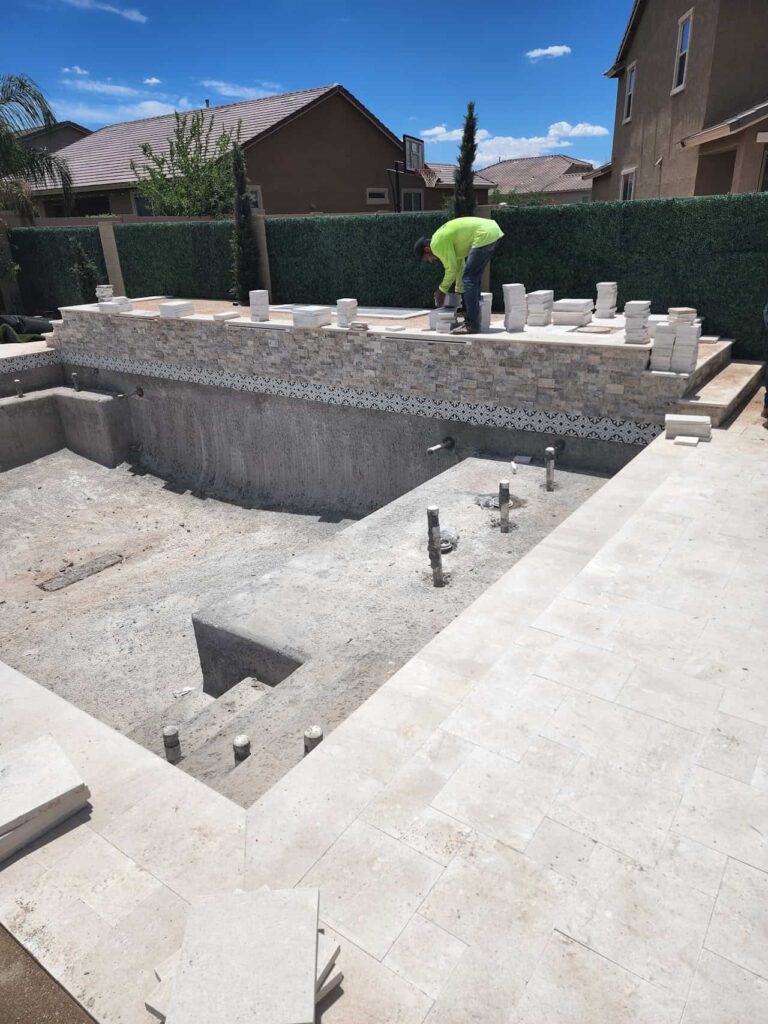 pool build with tile and raised wall install