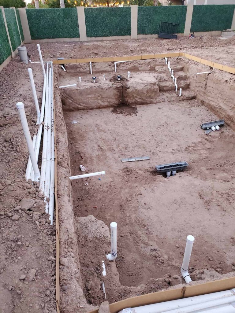 pool plumbing and excavation during construction