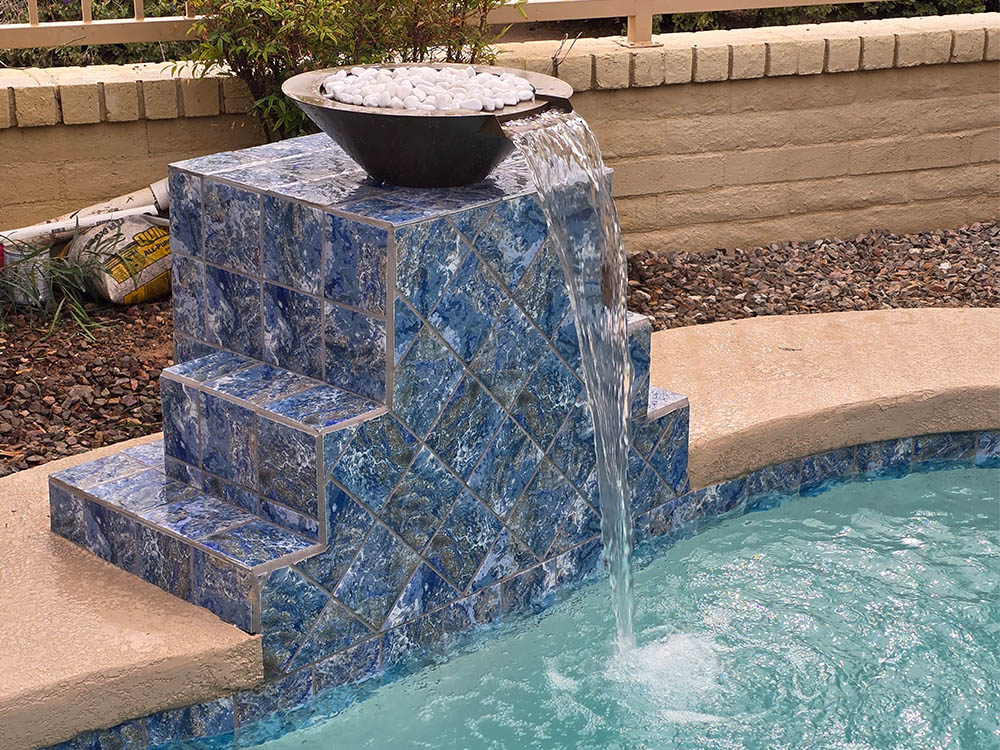 aqua squad raised pool water feature with spillway